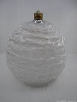 Full view of lucite globe showing overall form and texture