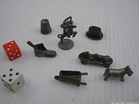Tokens and dice spread out on white background