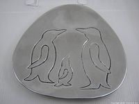 Top view showing etched penguin design and overall triangular shape