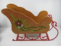 Left side view showing painted design and metal runners