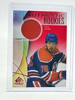 Front of Phil Kemp jersey patch card showing red fabric swatch and player image