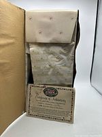 Interior of box showing tissue wrap and COA