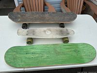 Three skateboards on table, top view