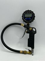 Full view of AstroAI digital tire inflator with hose and chuck