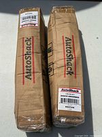 Two boxed AutoShack shock absorbers