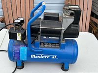 Right side view showing tank, motor, gauges, handle