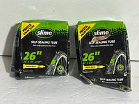 Front view showing two Slime self-sealing tube boxes