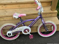 Full left side view of purple Supercycle kids bike
