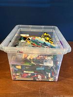 Overall view of clear tote filled with assorted Lego pieces