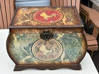 Front and top view of decorative wooden box with rooster graphics