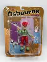 Front view of sealed Kelly Osbourne action figure in blister pack with accessories