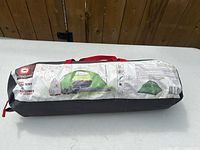 Tent packed in carry bag showing printed label