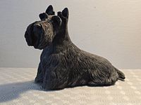 Front left view of Scottish Terrier sculpture showing textured fur and overall form