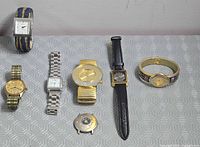 Group shot of all seven watches showing styles and bracelets