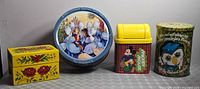 Front view of all four tins and banks