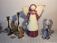 Group shot of all four angel pieces