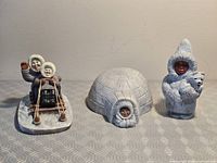 All three figurines displayed together