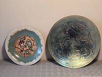 Front view of both enamel plates side by side