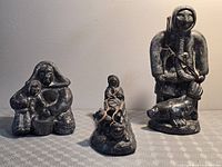 All three soapstone figurines grouped together