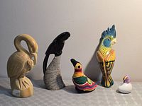 Group shot of all five bird figurines