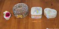 Four items lined up on wooden surface