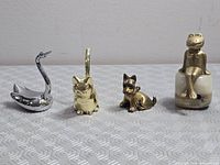 Front view of all four figurines lined up