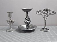 Front view of all three metal decor items