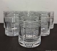 Eight Glen Plaid crystal whiskey glasses arranged; shows cut pattern and clarity