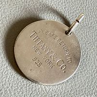 Front of pendant with "Please Return to Tiffany & Co. New York 925" inscription