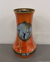 Full view of vase front, orange lustre glaze and cameo scene