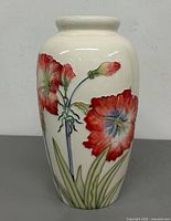 Full view of vase front showing hand painted dahlia design