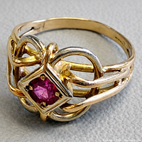 Top view showing ruby and openwork gold design