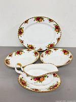 Full view of platter, bowls, gravy boat with underplate