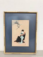 Full view of framed print showing bamboo-style frame and mat