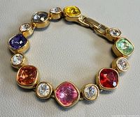 Full view of bracelet showing multicolored crystals and clasp