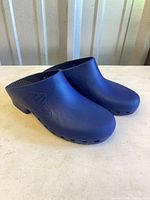 side view of blue BI-HOS clogs