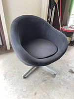 Front view of black fabric swivel accent chair