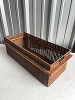 Angled view showing nested basket and outer wooden-rimmed base