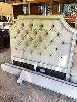Front view of tufted headboard and rails