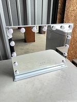 Front view of Fenchilin vanity mirror with LED bulbs