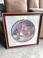 Front view showing framed floral print in burgundy frame
