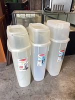 Front view of three Rubbermaid Wrap n Craft storage boxes showing labels and overall condition