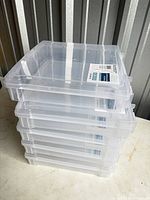 Stack of five clear square storage cases