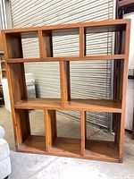 Front view of staggered-shelf pine bookcase