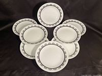 Eight plates arranged to show full set and pattern
