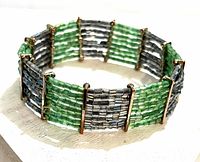 angled view of bracelet showing bead colors and gold-tone spacers