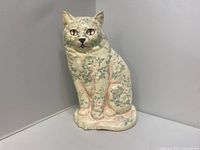 Full view of floral decoupage cast iron cat door stop