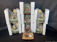 All eight candle toppers in Styrofoam sleeves with coffee design displayed front