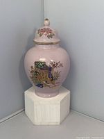Front view showing floral decal and lid