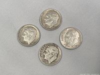Obverse of four Roosevelt dimes showing dates 1946, 1960, 1962-D, 1964